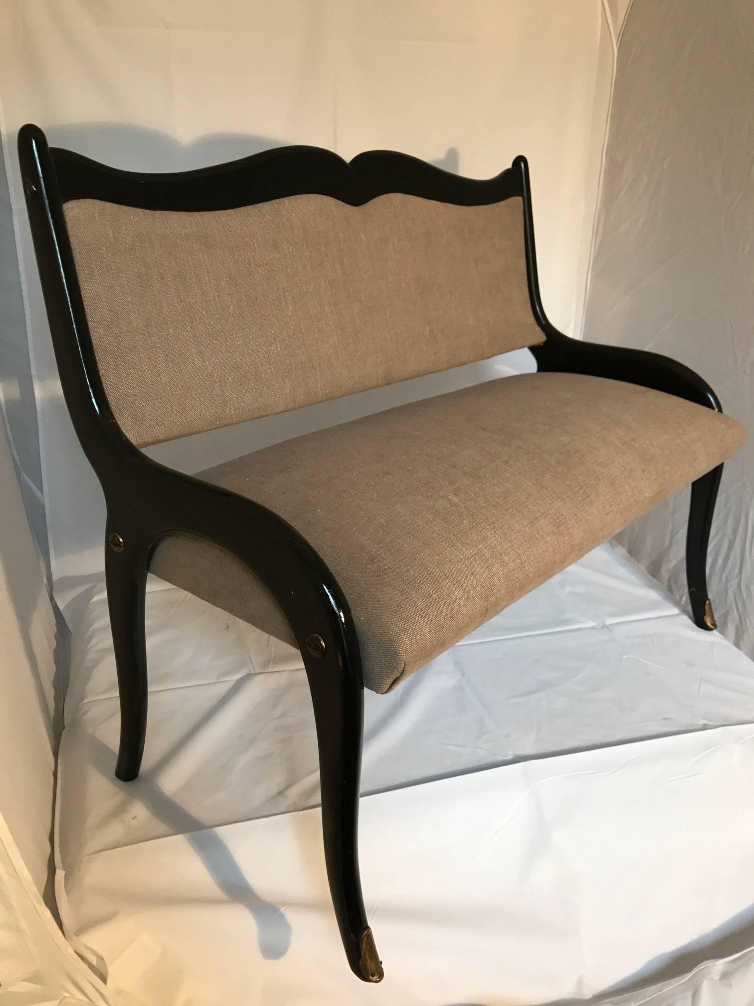 This 1950s Italian bench been reupholstered in linen and ebonized frame, front feet have brass sabot, perfect for children's room.