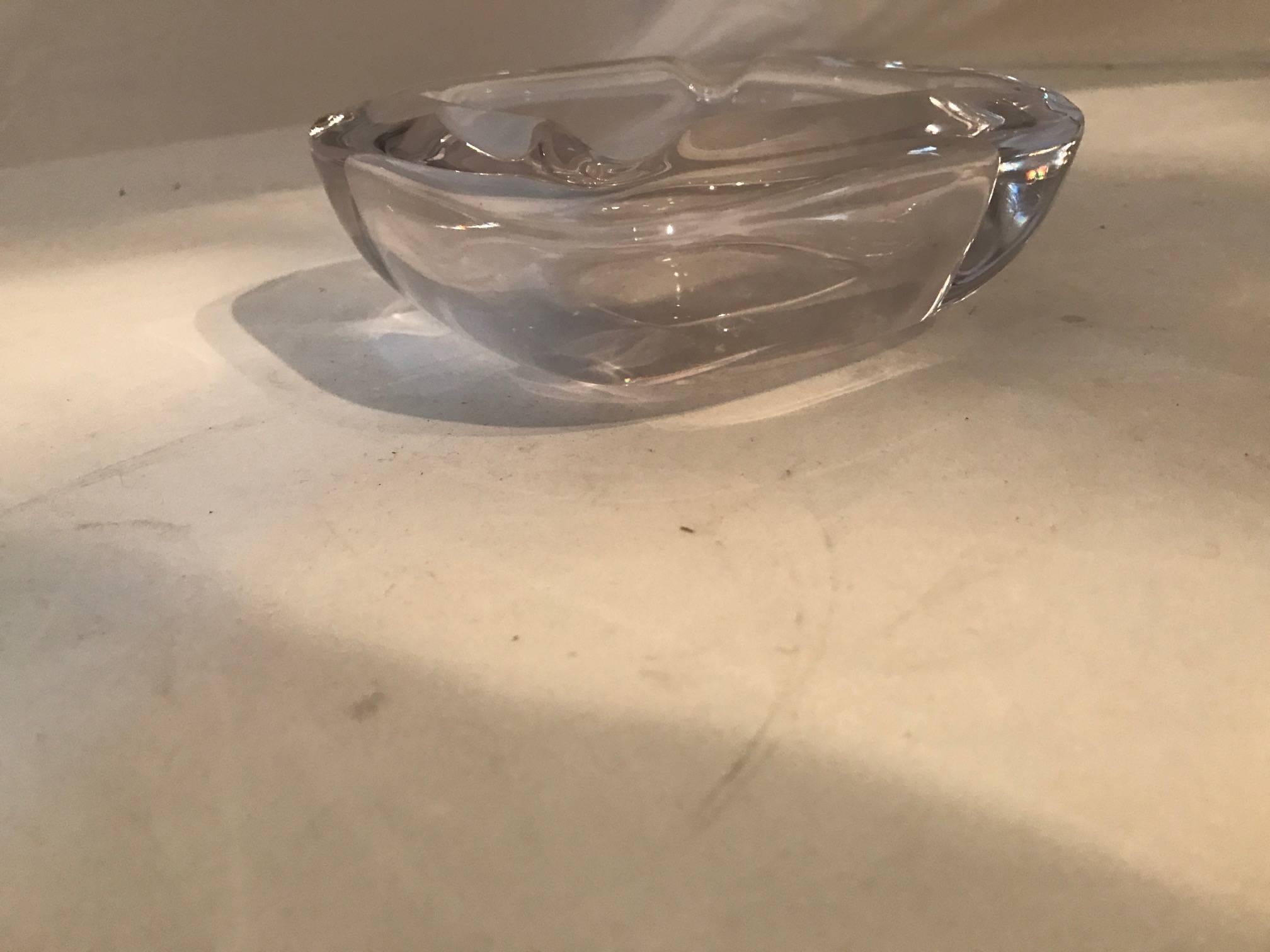 Pinkish thick glass ashtray-bowl, circa 1950s French with a company stamp on the bottom.