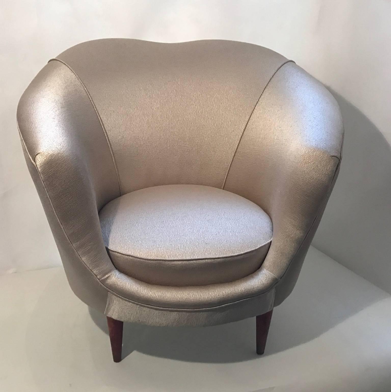 A pair of 1950s armchairs, upholstered in silver silk and ebonized feet. In the style of Ico Parisi, Italy.