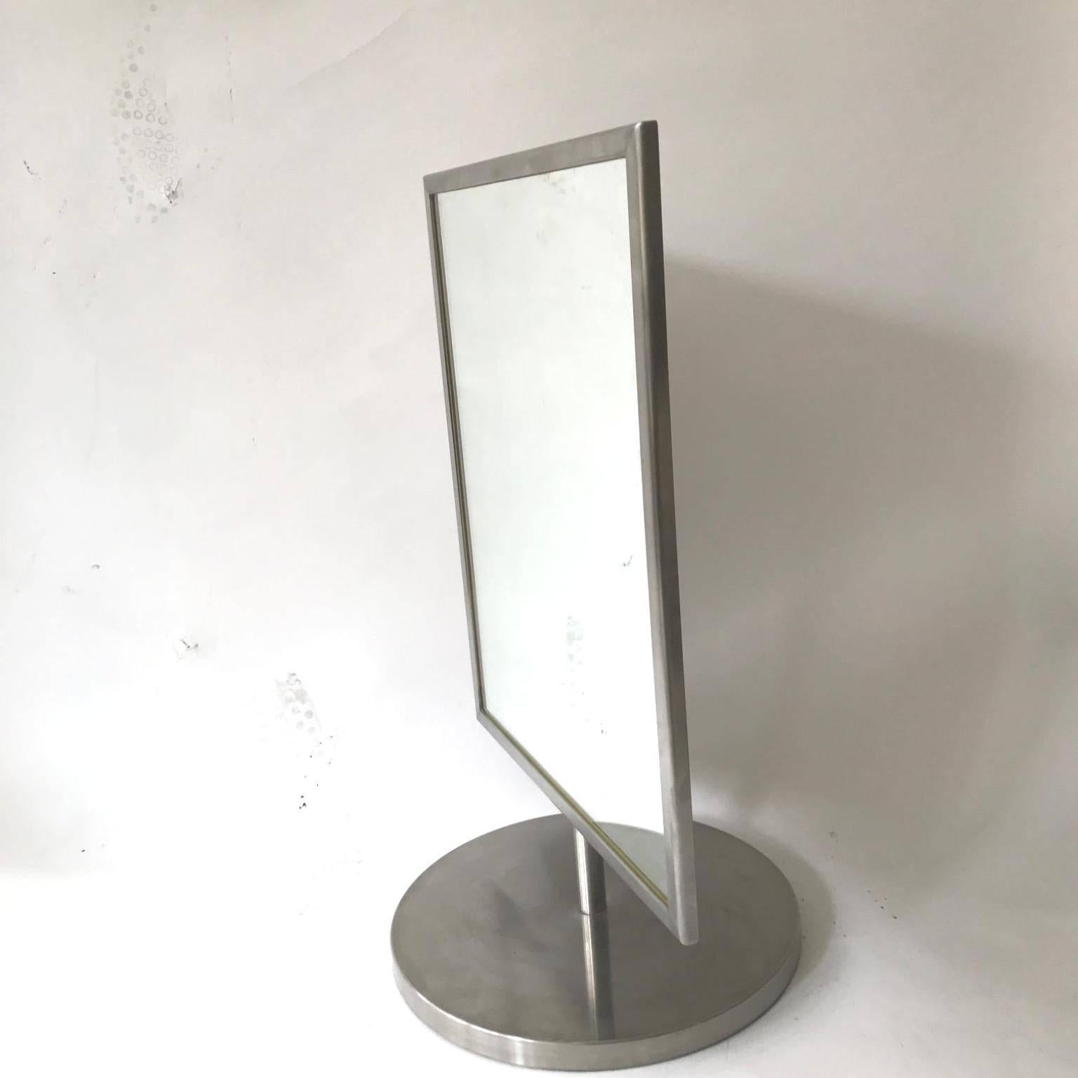 These two vanity swivel mirrors in polished steel frame and the base. Italian, circa 1970s. Would be perfect as a pair on the vanity table but can be separated and purchase just a one.