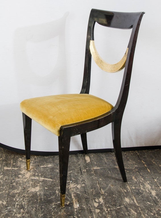 1940s Italian set of eight dining chairs with original upholstery, dark polish and gild middle part, with brass sabot on the front legs.
