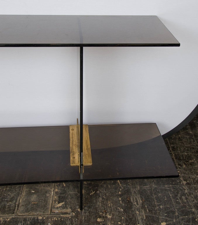 Smoke glass and brass support two tiers console/table, top glass is removable.