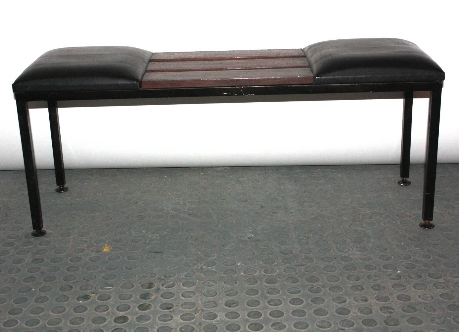 An Italian 1950 bench on black painted metal frame and three stripes in mahogany with attached two black leather cushions.