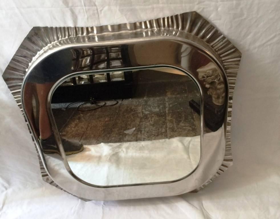 A 1970's aluminum mirror