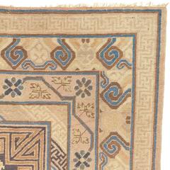 Early 20th Century Tawny Brown Geometric and Stylized Floral Khotan Carpet
