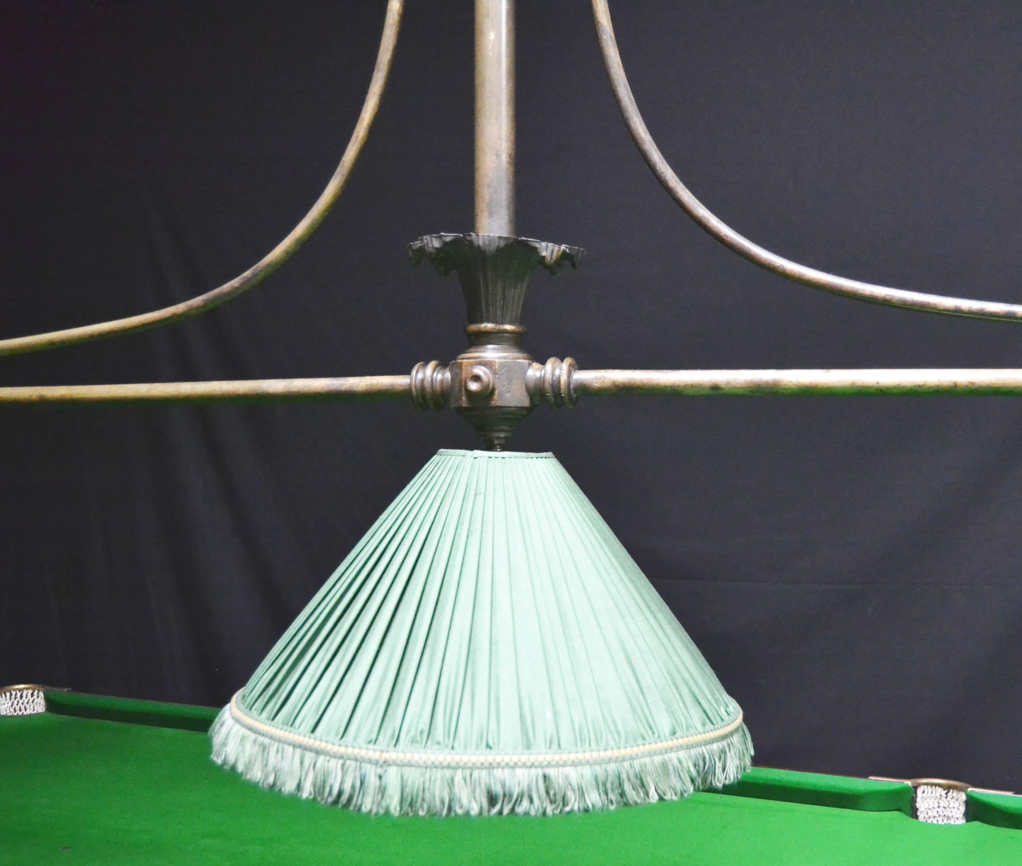 A very well made decorative brass framed antique billiard lamp manufactured circa 1890, the brass has aged very nicely and created an excellent patina, this lamp would be ideal for a 3/4 sized table, it is very elegant and features reeded sections