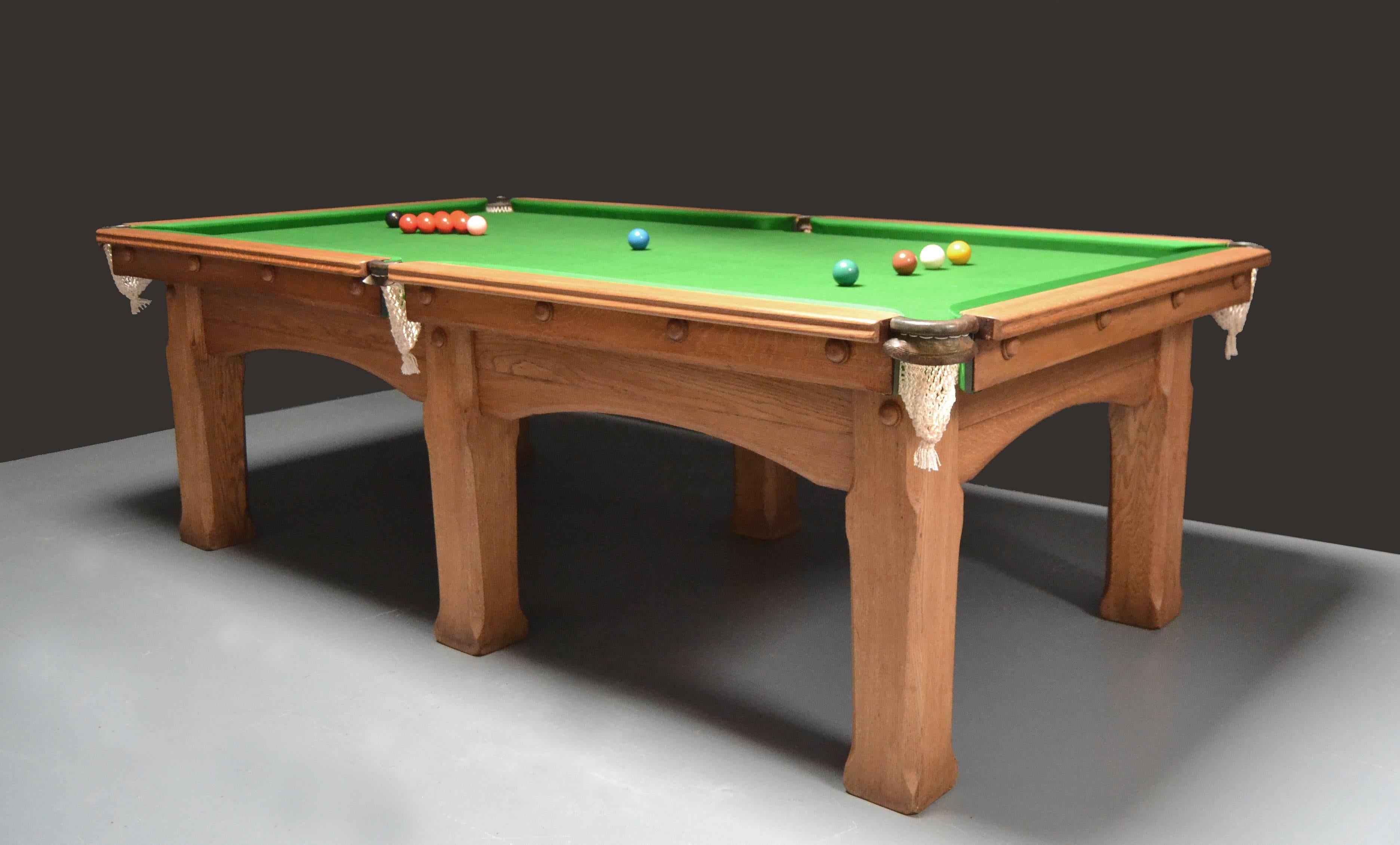 A rare solid oak 8ft x 4ft Arts & Crafts antique billiard Snooker or pool table circa 1910,retains original leathers , handsome solid frame with shaped and chamfered legs, supporting a three piece slate bed, the table plays superbly.

The timber