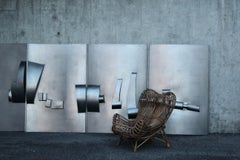 Set of four stainless steel wall sculpture panels, likely by a Swiss sculptor