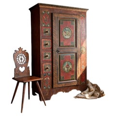 Swiss Alpine wardrobe consisting of a row of drawers and a storage door