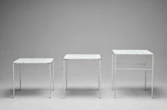 white perforated sheet metal nesting tables by Mathieu Matégot