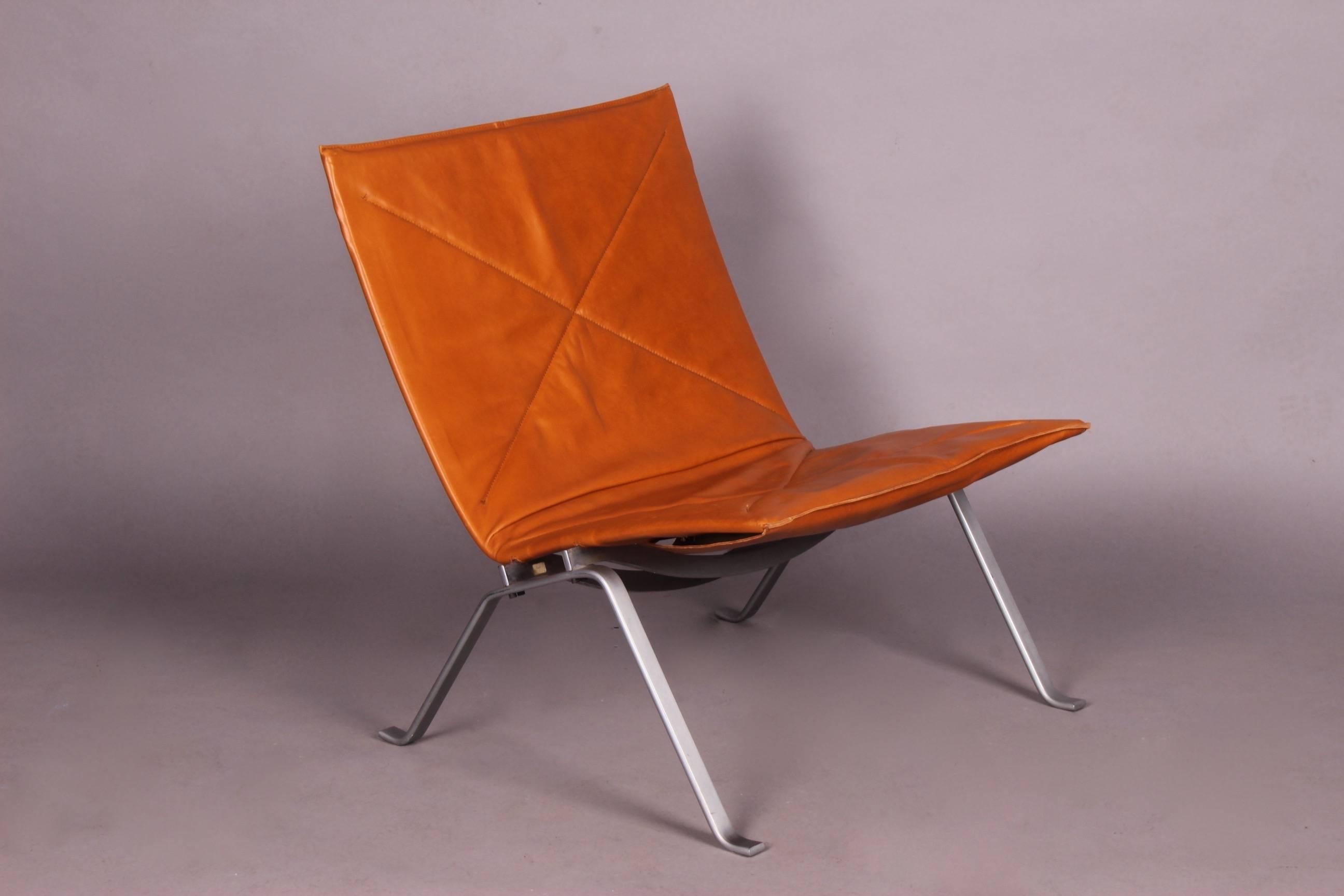 Leather and metal lounge chair by Poul Kjaerholm ed Christensen with stamped new cognac leather.