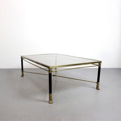 Coffee table in gilt bronze and black lacquered metal with a glass top - France