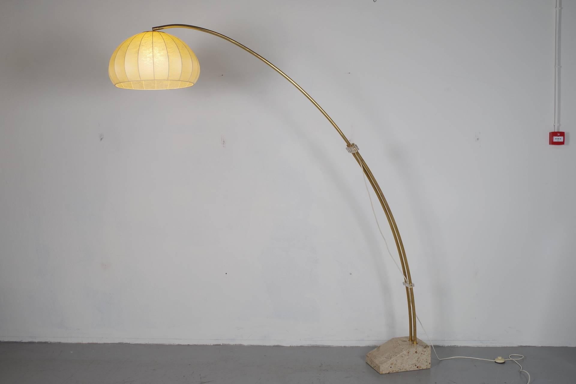 Beautiful bow lamp by the German manufacturer Hustadt. The bow is adjustable in lenght and height. The heavy terazzo base makes the lamp very stabile. 
Measurement of the shade is 55 cm.