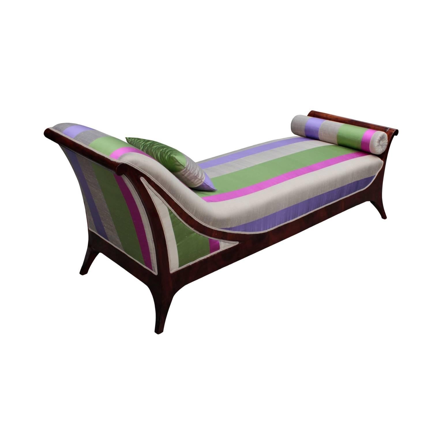 Rare, elegant and comfortable Austrian Biedermeier period daybed of curvilinear design with splayed and tapered legs. In French walnut, covered with fine 100% Spanish silk, fabric design emulating Biedermeier period wallpaper. 