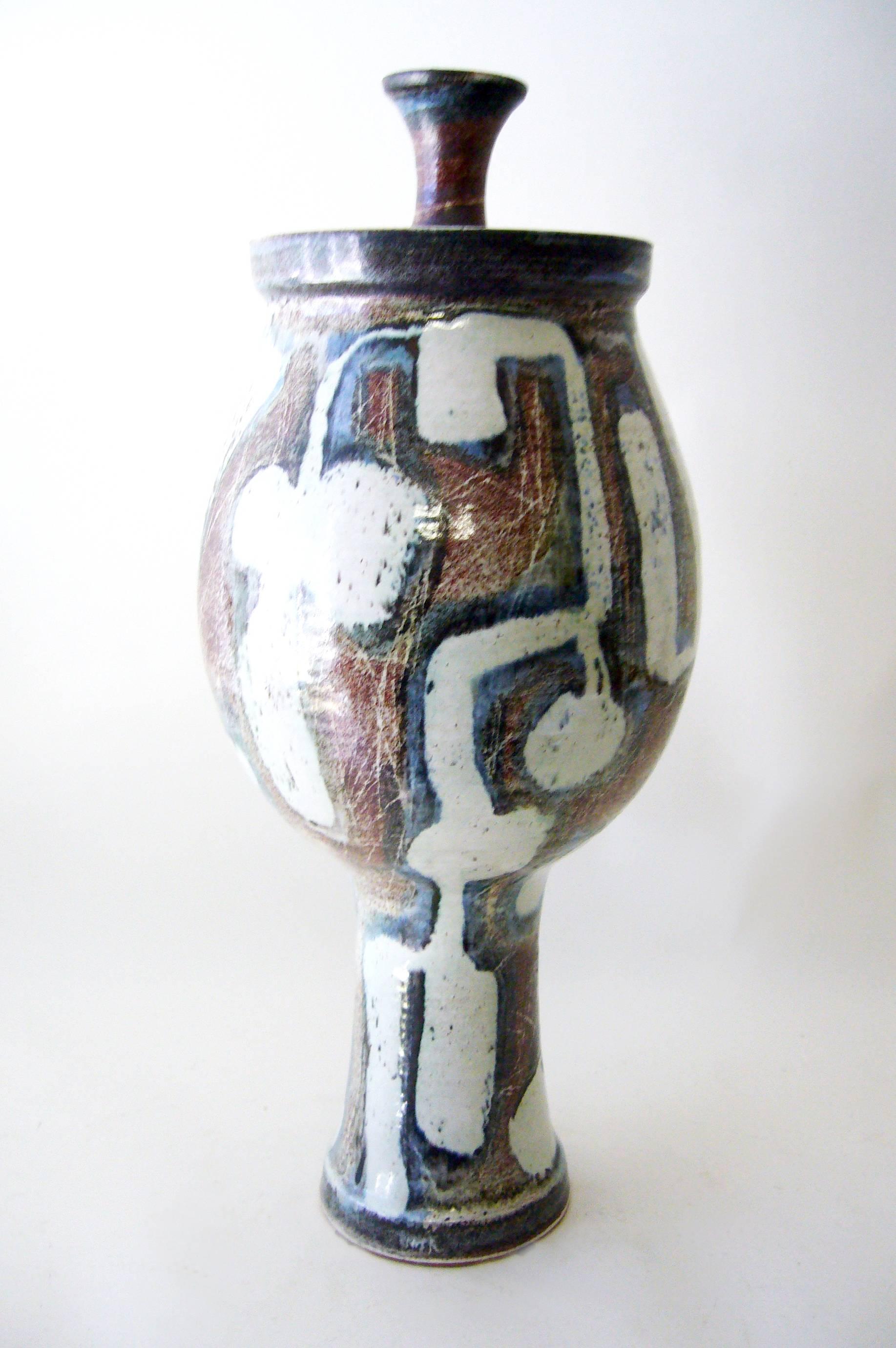 Large-scale lidded glazed stoneware urn with abstract modernist decoration by Larry Goldman. Piece measures 21.5