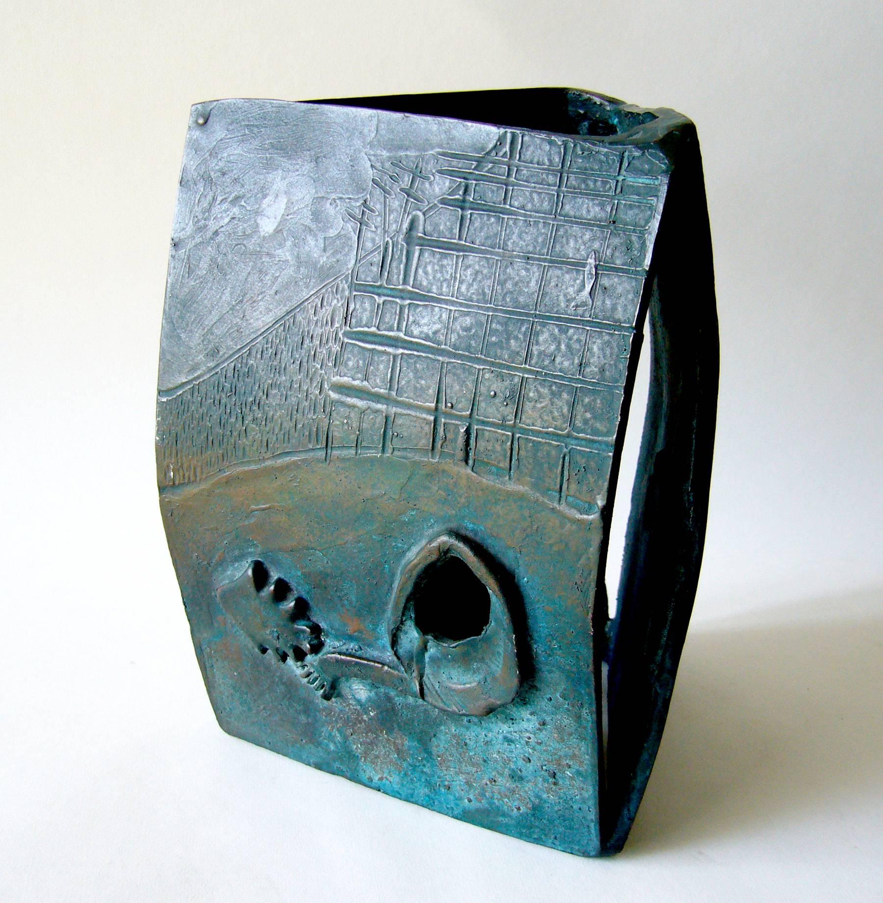 Heavy, three-sided cast bronze sculpture in Asian modernist style. Sculpture measures 9.5