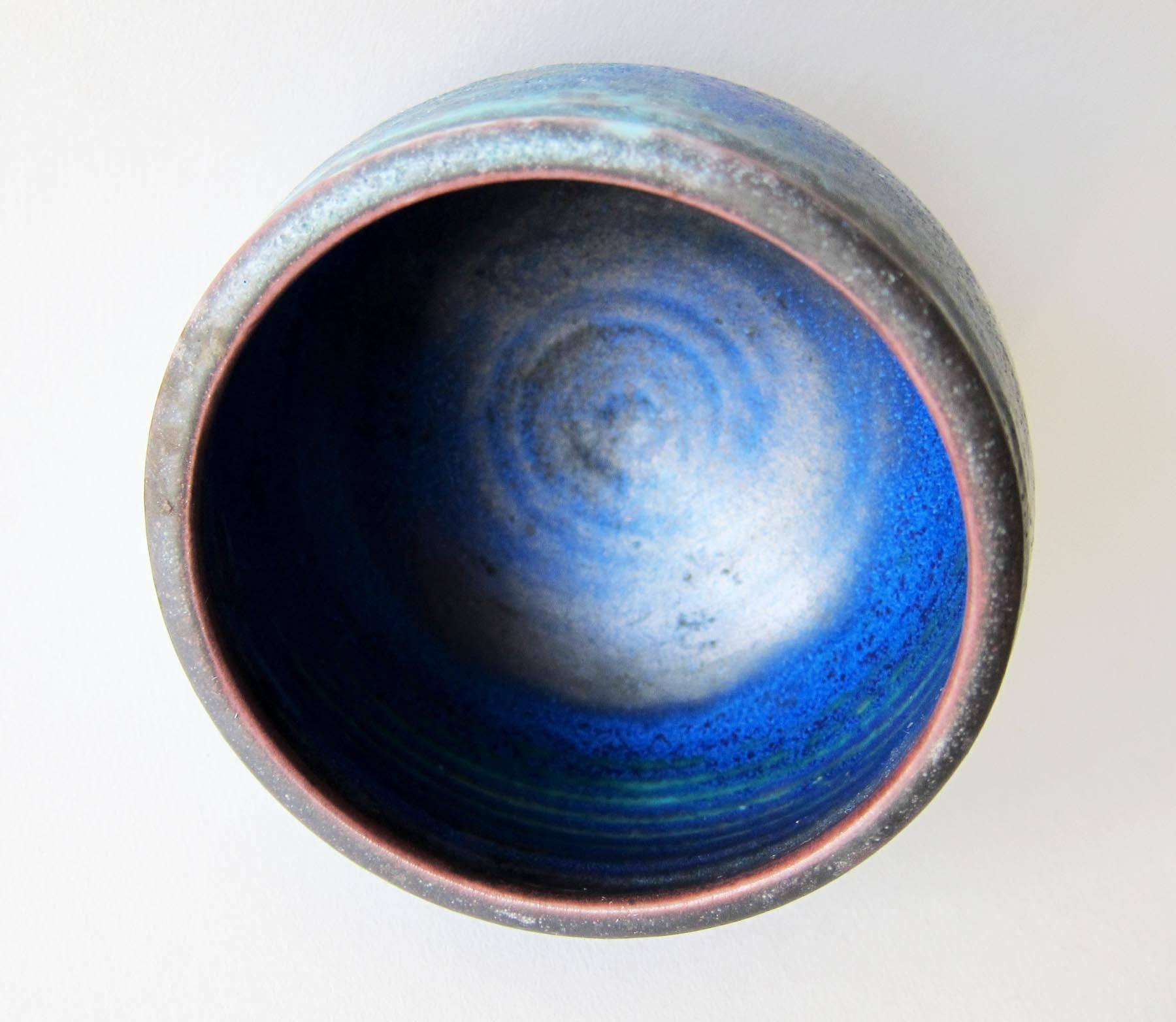 Stoneware bowl with cobalt glazed interior, created by Otto and Vivika Heino of Ojai, California. Bowl measures 3.25