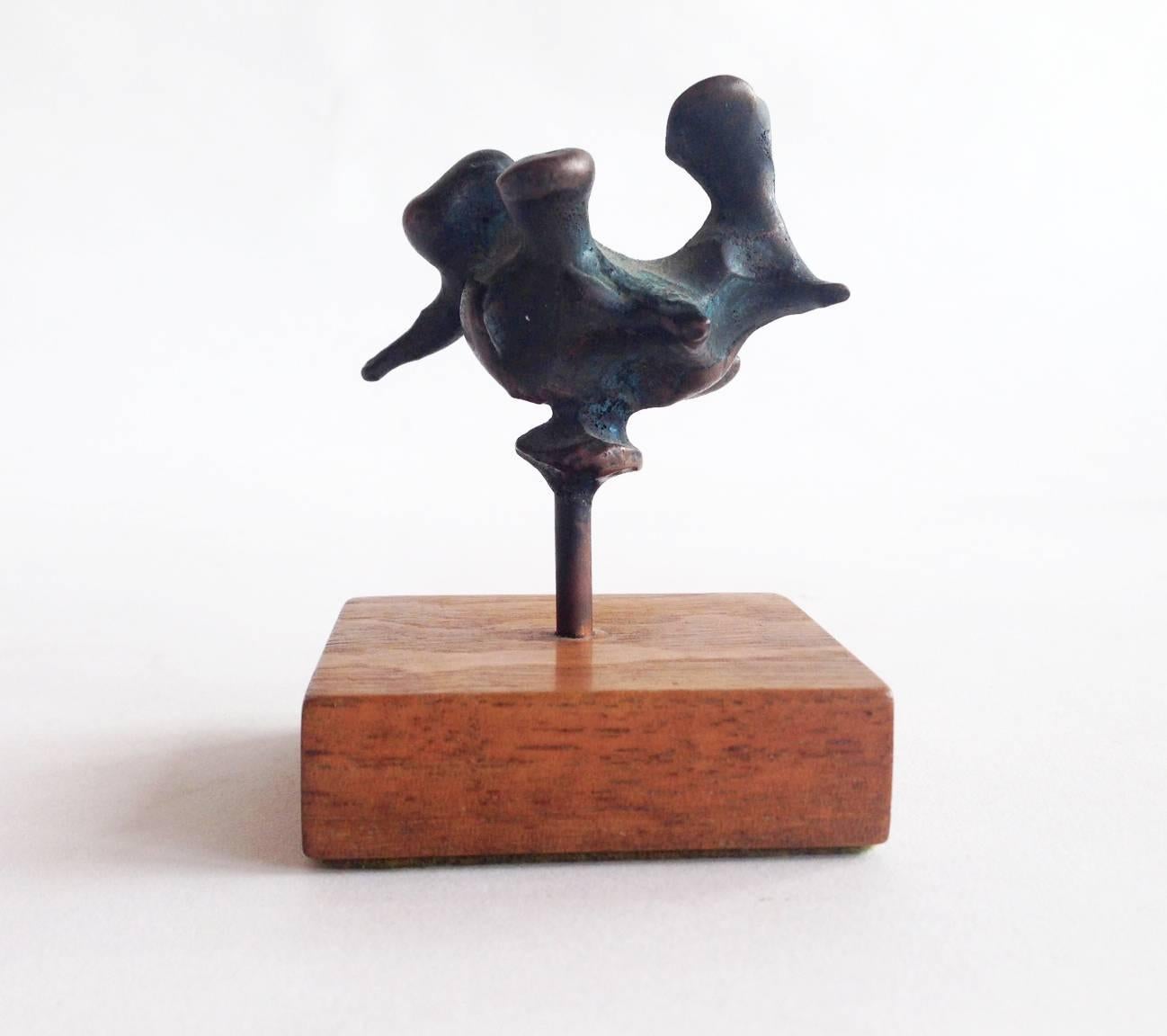 Abstract bronze sculpture on wood base created by Jack Boyd of San Diego, California. Sculpture measures 3