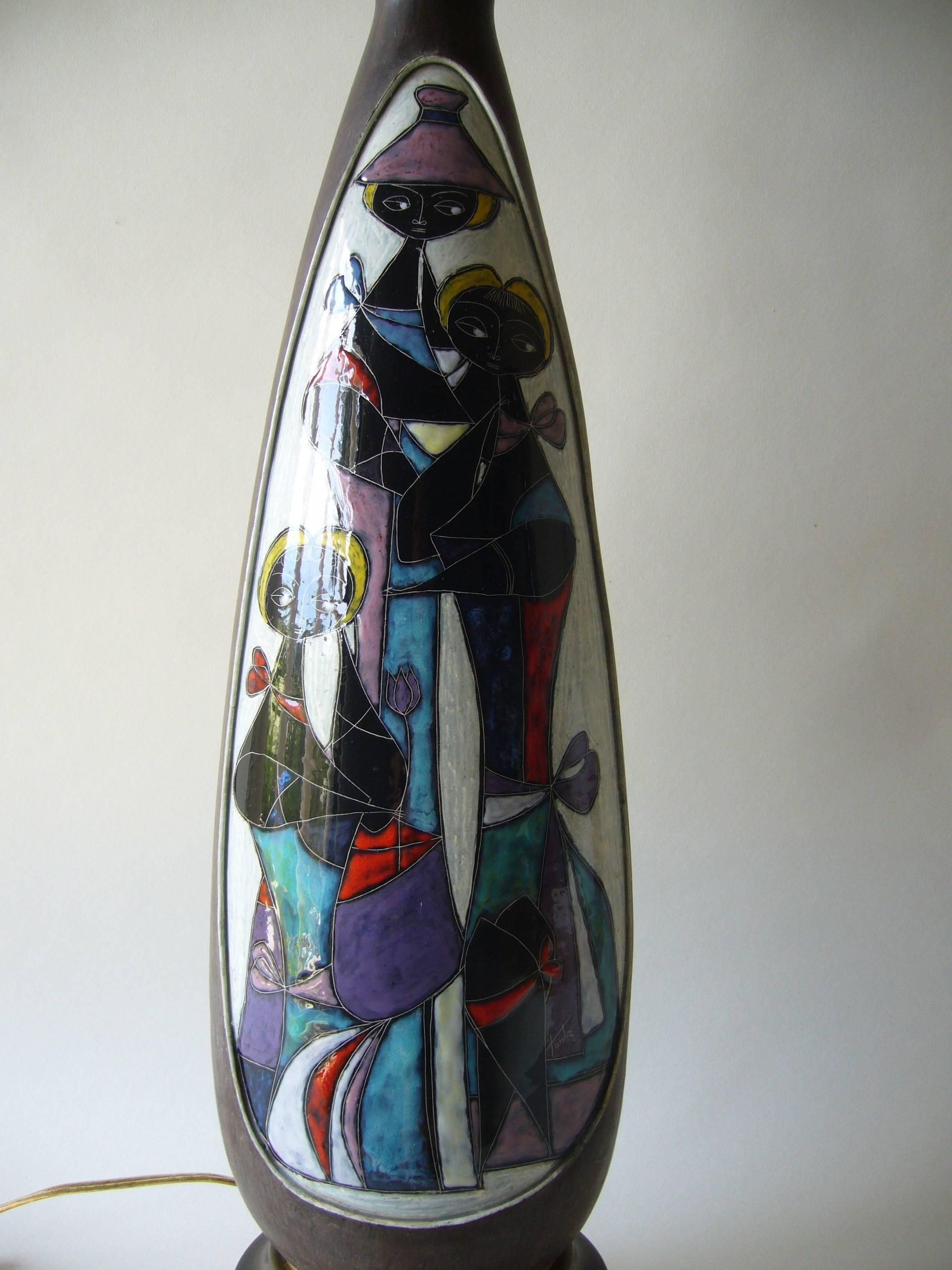 Figural ceramic lamp base made by Marcello Fantoni of Florence, Italy. Lamp features modernist figures that Fantoni used often in his lighting and ceramic designs. Lamp base measures 24