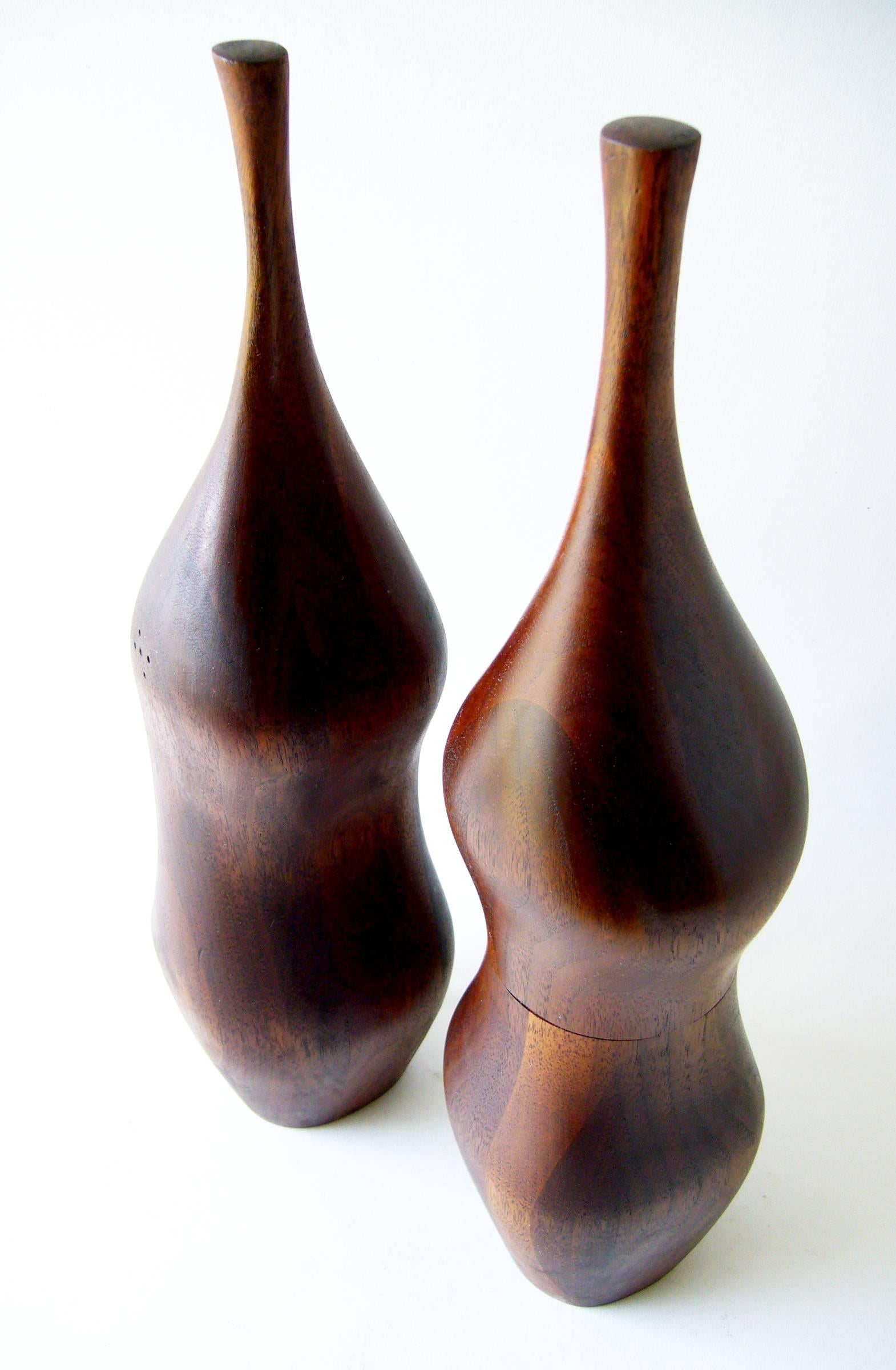 Sculptural, hand-carved laminated fruitwood salt Shaker and peppermill created by Daniel Loomis Valenza of New Hampshire. Large in scale and measuring 15.5
