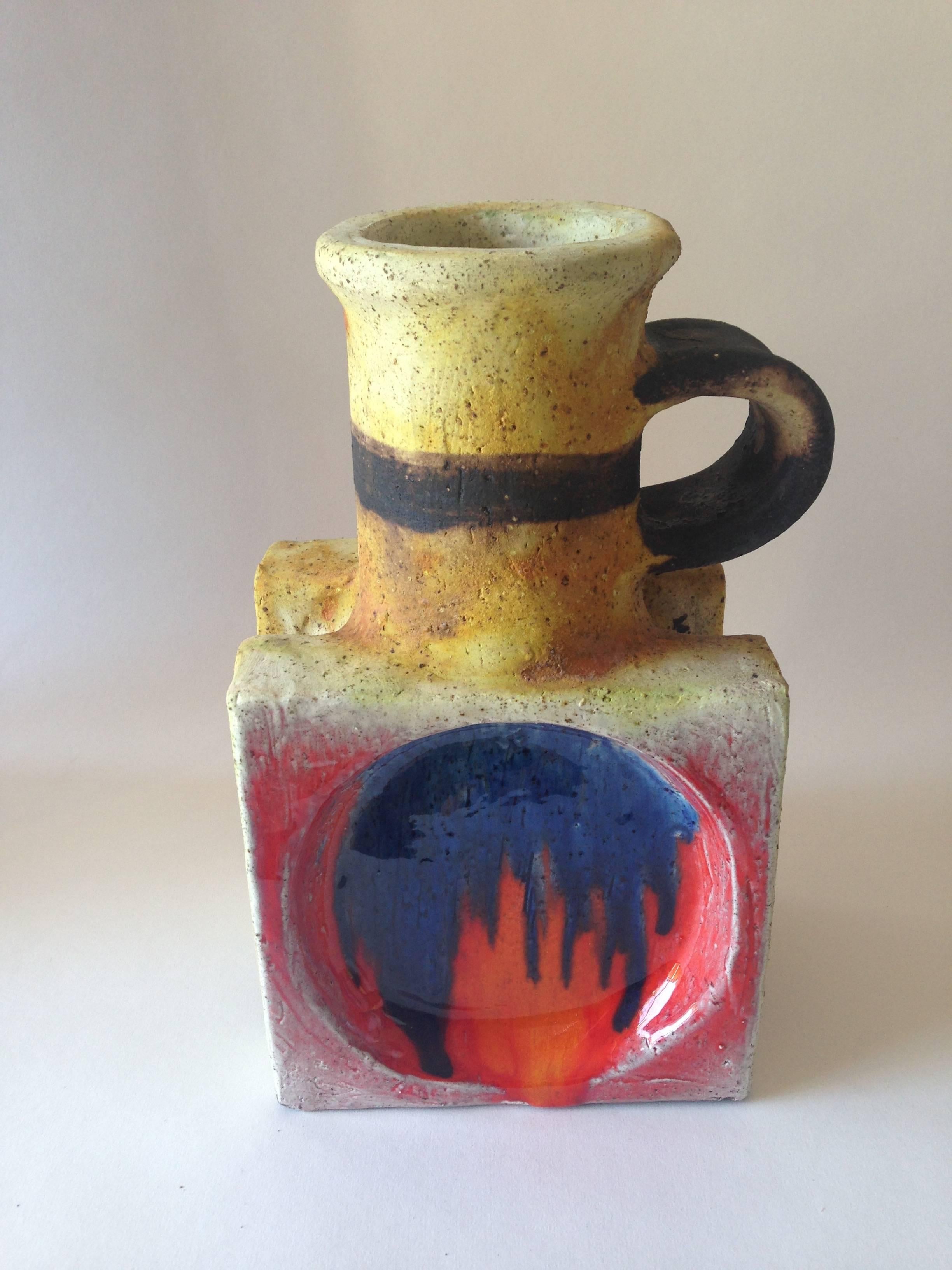 Colorful Italian modernist ceramic ewer created by Ivo De Santis for Gli Etruschi. Ewer measures 11" tall by 6.5" wide by 5" deep and is unsigned. In excellent vintage condition.