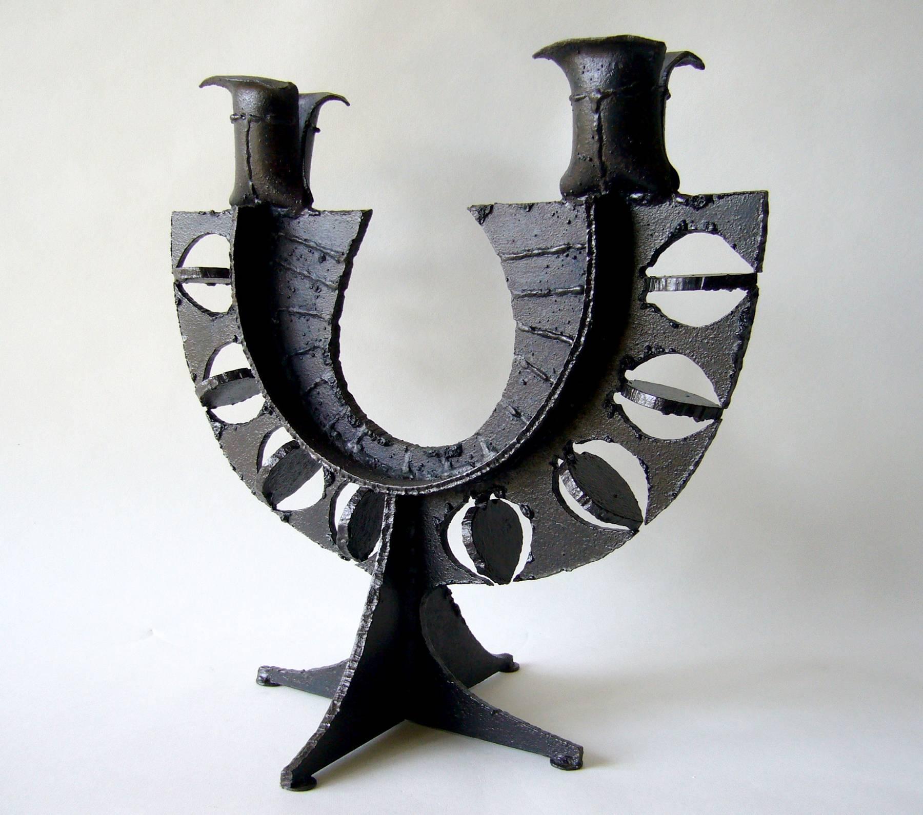 Torch cut metal candelabra in the Brutalist style created circa 1960s. Candelabra measures 16