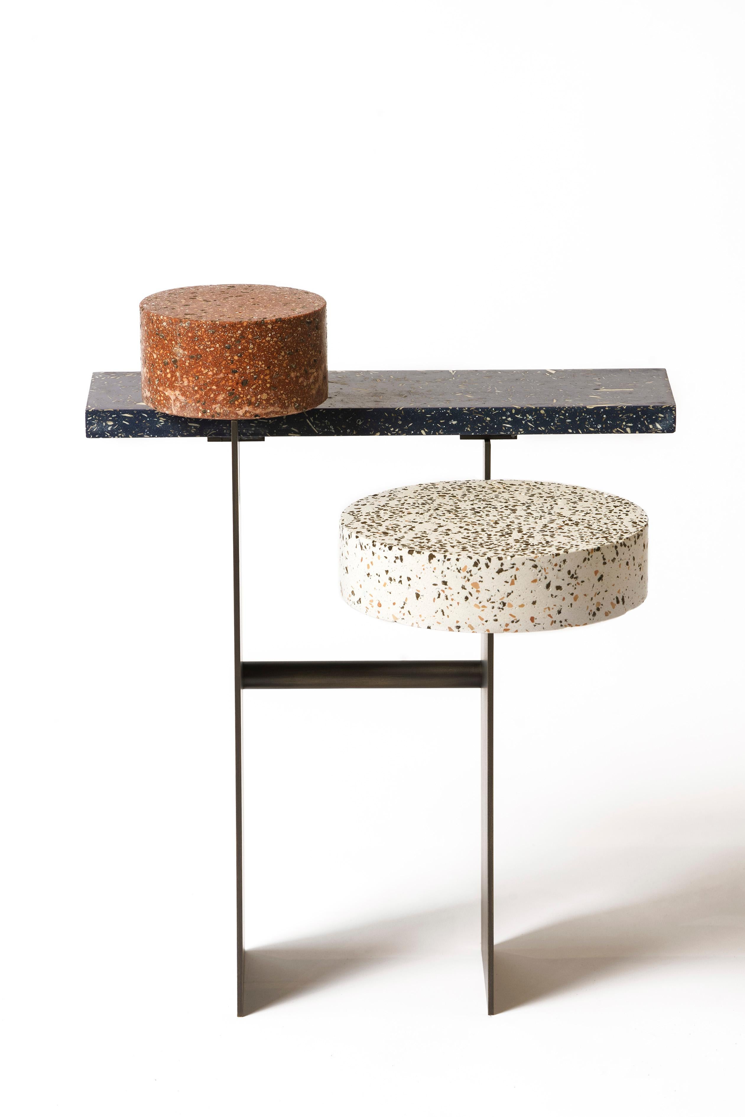 The compound material is made up of biomaterials or stones which play
aesthetically with fragmentation while the binding material smoothes out any
irregularities.

“It is a research of the contrast and harmony between the solid/rigid, and