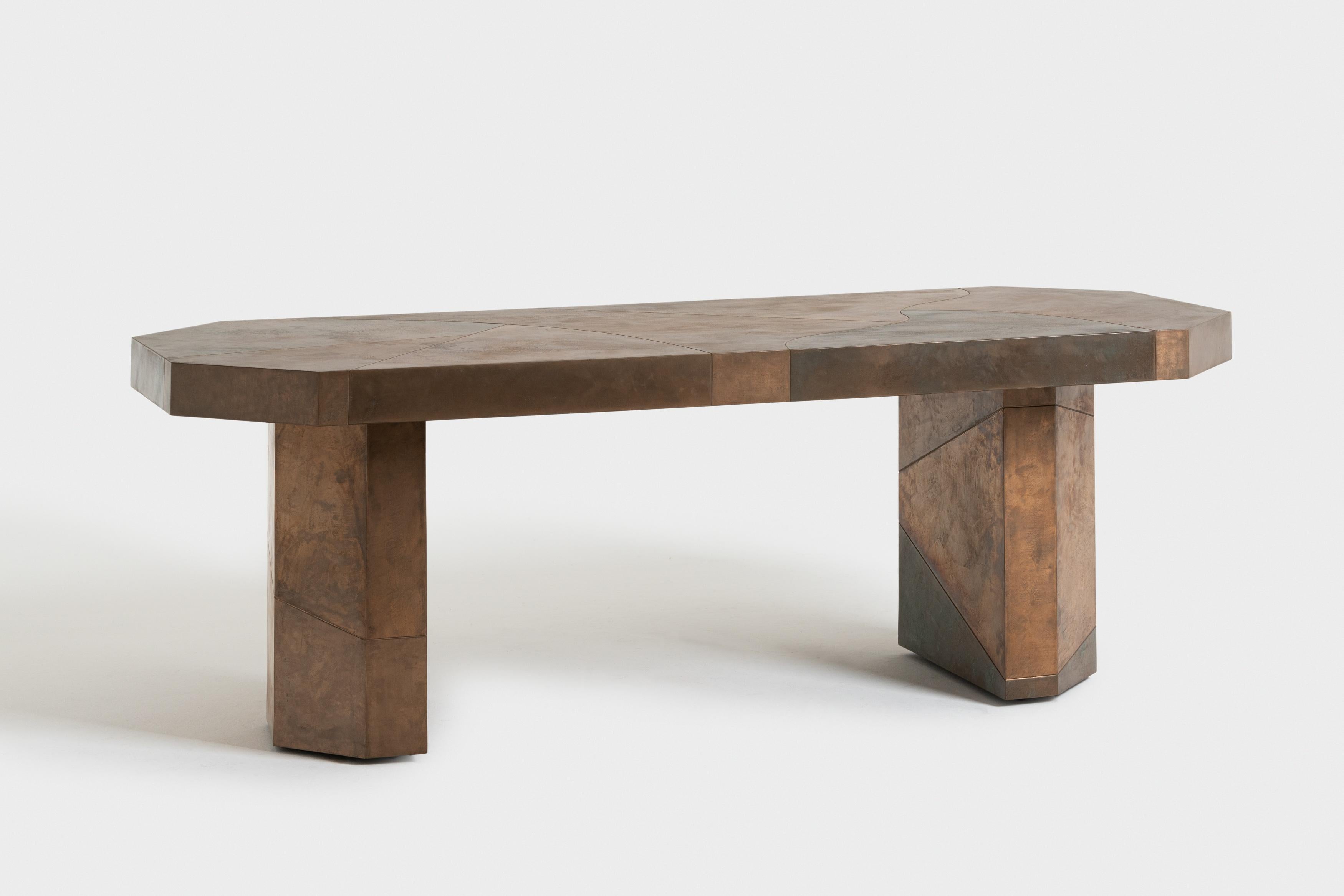 Finished with layers of polished raw metal, it exudes elegance and sophistication. However, what truly sets this table apart is its unique use of color. By juxtaposing different shades of oxidation, Cibic has created a stunning visual effect that