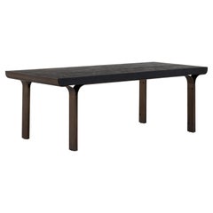 Osvaldo dining table in burnt oak and brass-plated by Fabio Fantolino