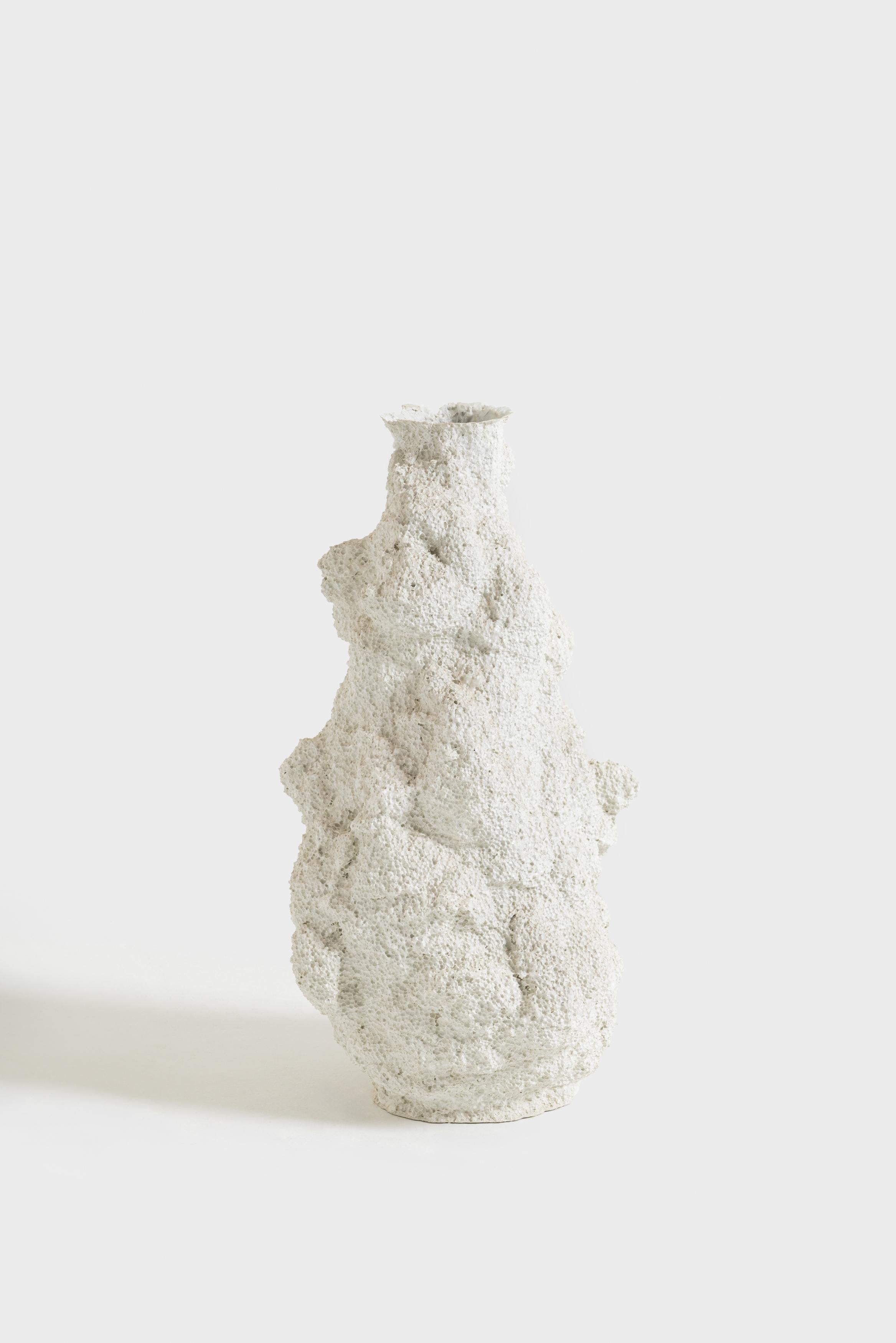 FDV is a collection of sculptural vases literally emerging from a block of Polystyrene. The block is first melted on the inside through acetone to obtain a partially controlled void, where the flowing of a mass of concrete leaves some of its fluid