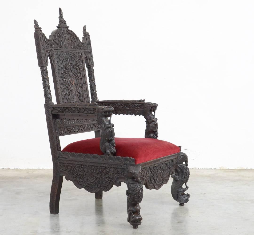 This extraordinary Anglo-Indian carved hardwood armchair or throne can be dated in the late 19th century.
The backrest is exquisitely carved with an image of Krishna and Vishnu surrounded by florals.
The top is decorated with three carved