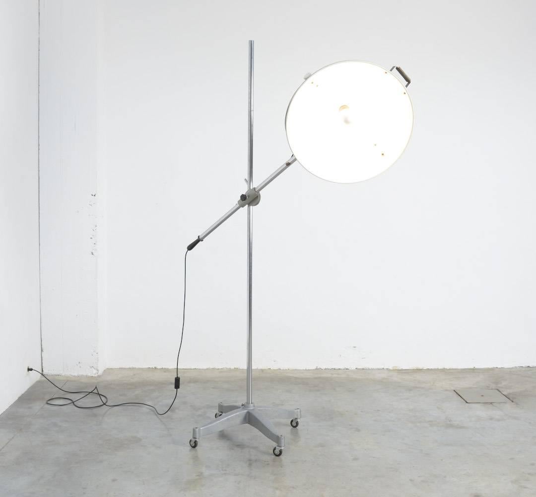 This amazing floor standing studio lamp was produced by Narita in Belgium in the 1950s.
This impressive lamp is moveable on its four casters. The lampshade (diameter 60 cm) is turnable in each direction you prefer.
With its height of 2.25 m it