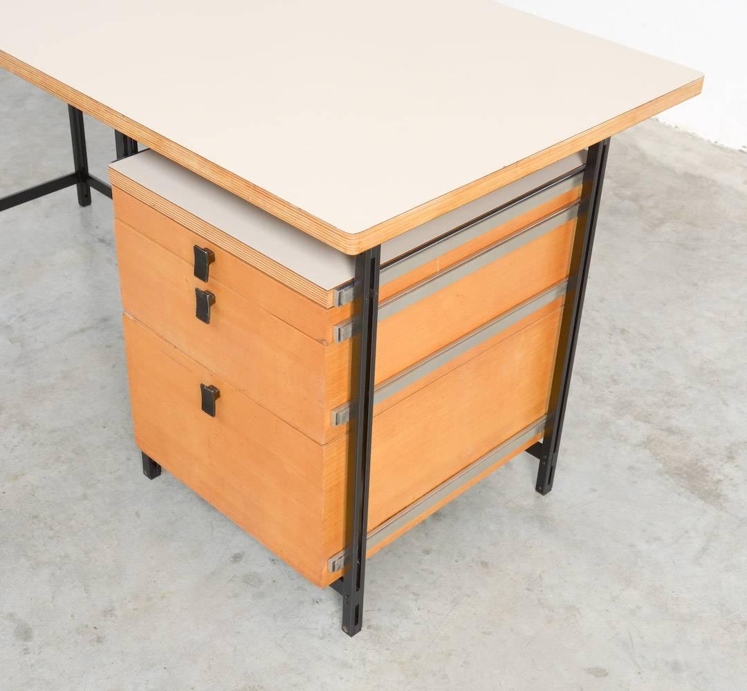 This desk is a well-known design of the Belgian designer Jules Wabbes and can be dated in the early 1960s.
We offer you a nice pair, manufactured by Mobilier Universel and marked on the inside of one drawer.
These desks are very attractive with
