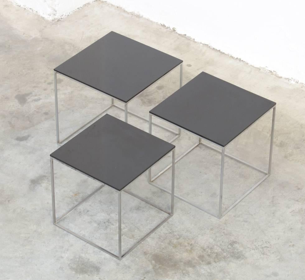 This nice minimal set of nesting tables was designed by Poul Kjaerholm for E. Kold Christensen, Denmark in 1957.
The chrome brushed steel frames are complete with the original black acrylic tops.
These side tables are in very good original