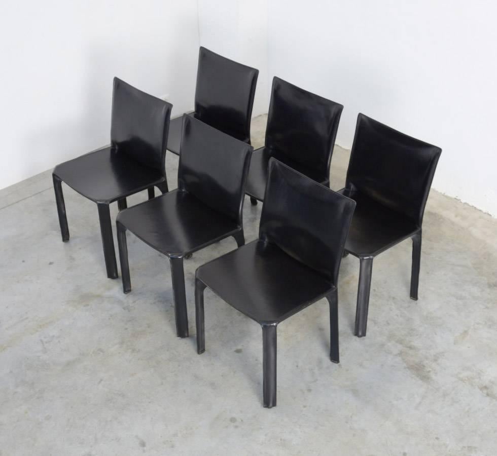 Very beautiful set of 4 original black CAB chairs designed by Mario Bellini in 1977 for Cassina, Italy.
The CAB chair has an enamelled steel frame and the black leather upholstery is zippered over the frame. This minimal chair in strong leather is