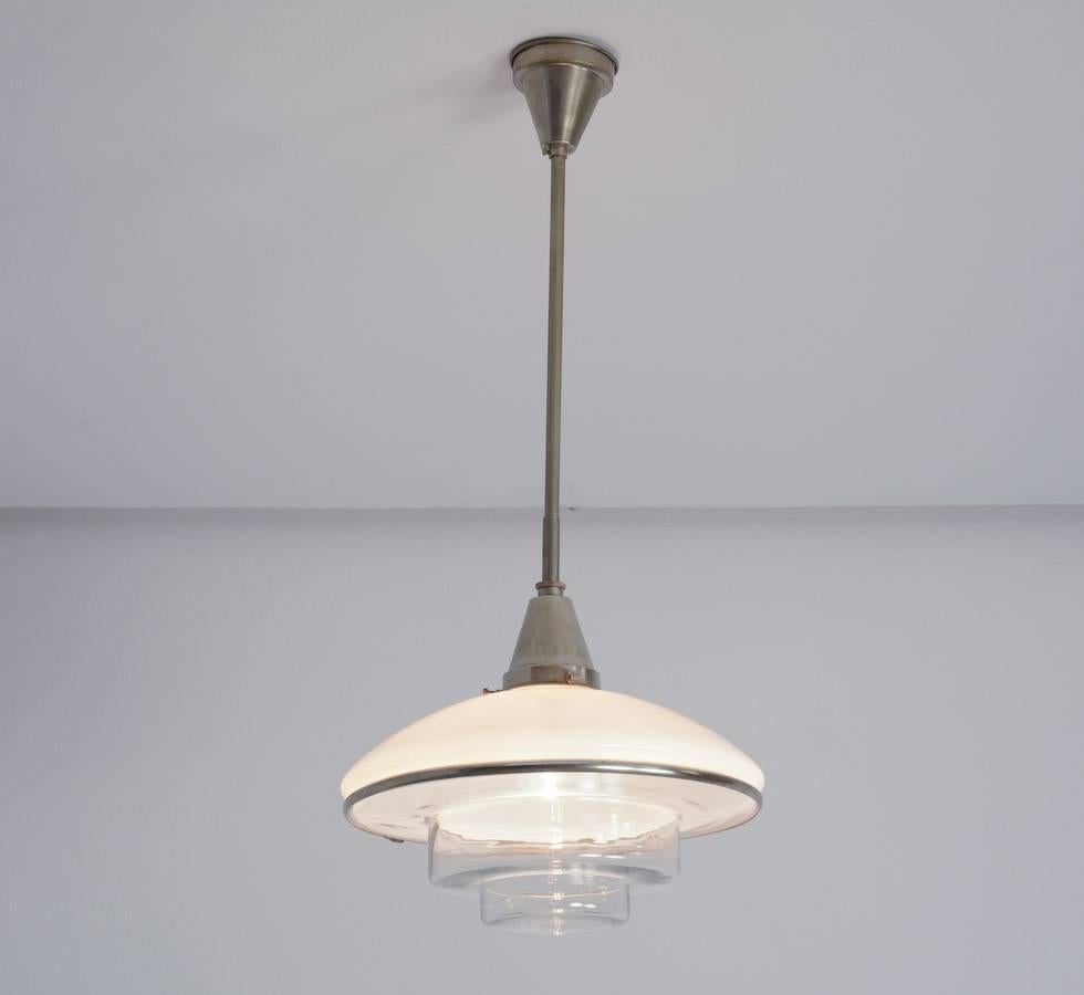 This pendant lamp was designed by Otto Müller in 1931 and manufactured by Sistrah Licht GmbH in Germany. 
The name Sistrah derives from the German 