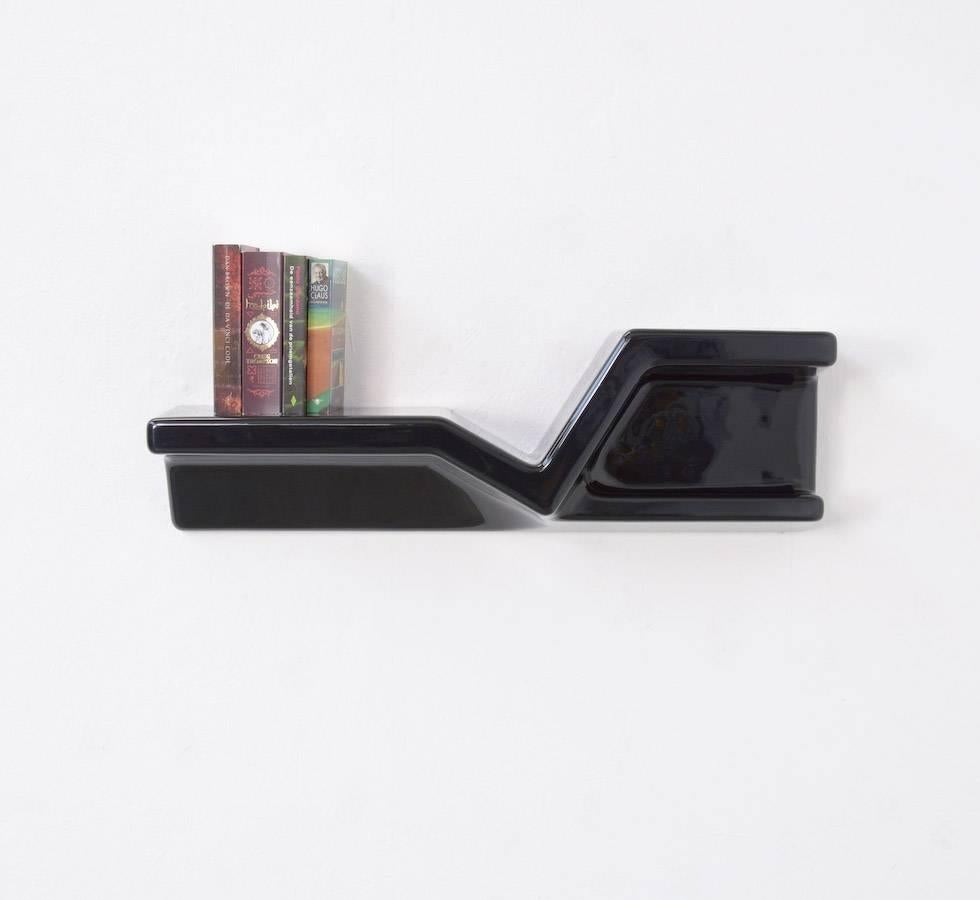 This sculptural floating shelf was designed by Nani Prina for Sormani (Arosio) in 1972.
It is made of black ABS plastic and used to be a telephone shelf.
This rare shelf is in very good vintage condition, with some minor scratches.

Domus 509,