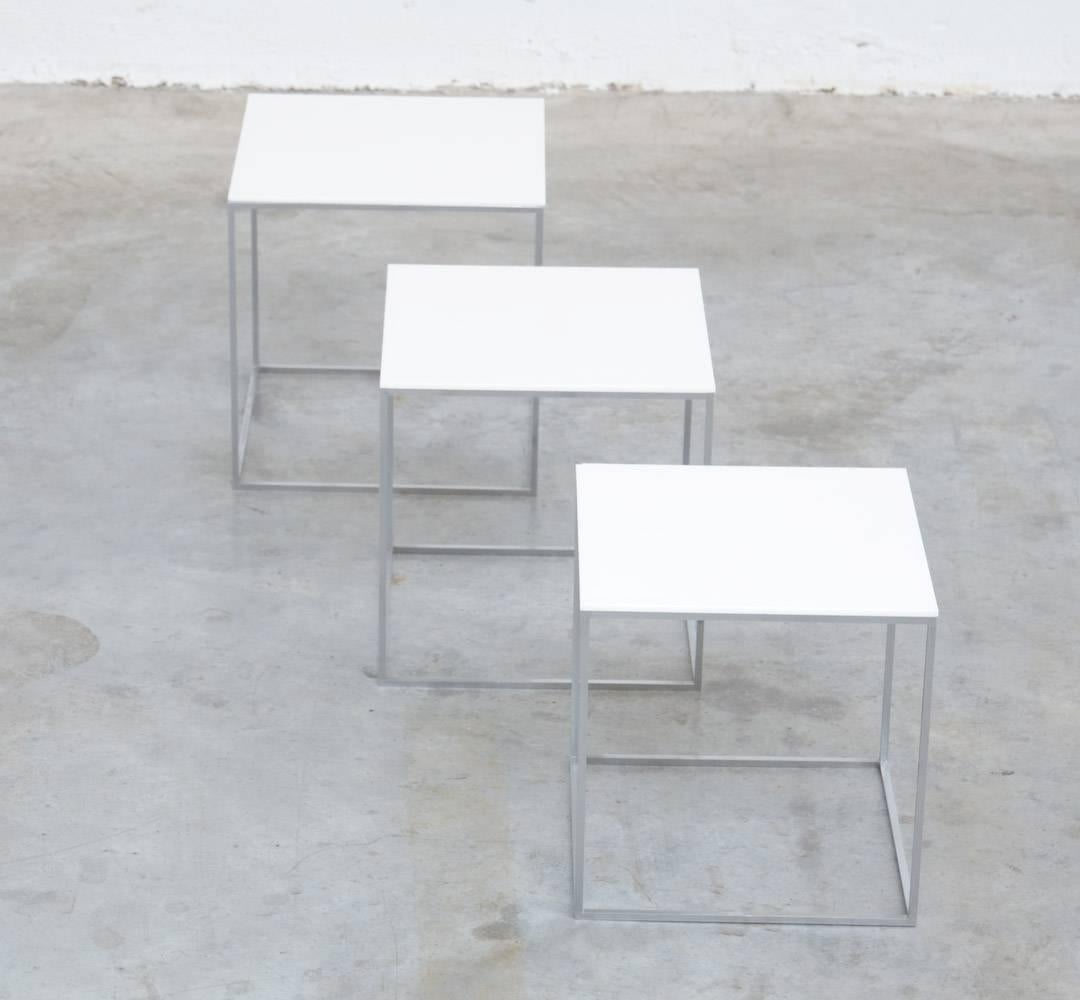 This nice minimal set of nesting tables was designed by Poul Kjaerholm for E. Kold Christensen, Denmark in 1957.
The chrome brushed steel frames are complete with the original white acrylic tops.
These side tables are in very good original