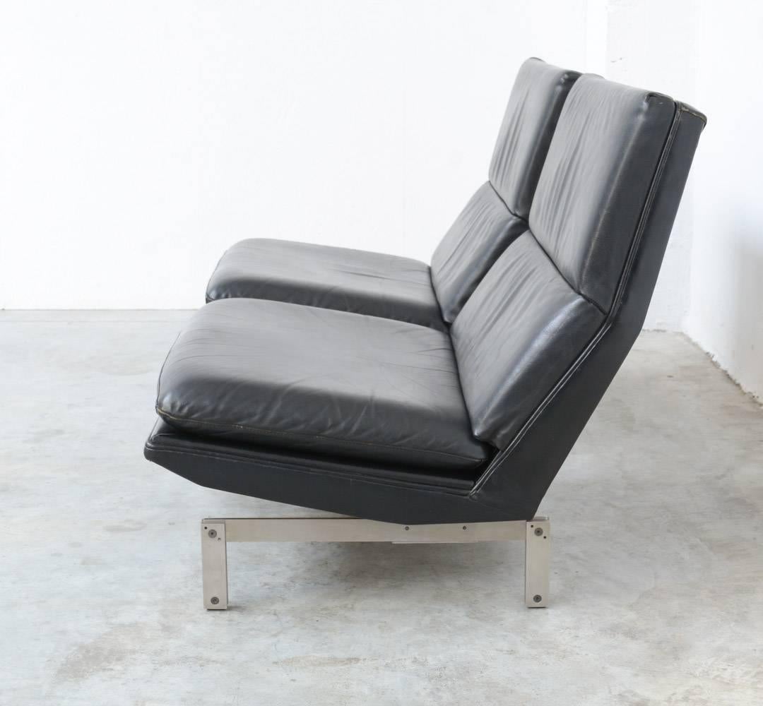This pair of low easy chairs is designed by Georges-Charles Van Rijk for Beaufort, Belgium in the 1960s.
The seat is made of black leather and fixed on a minimal matte stainless steel base.
These minimal easy chairs are in very good vintage