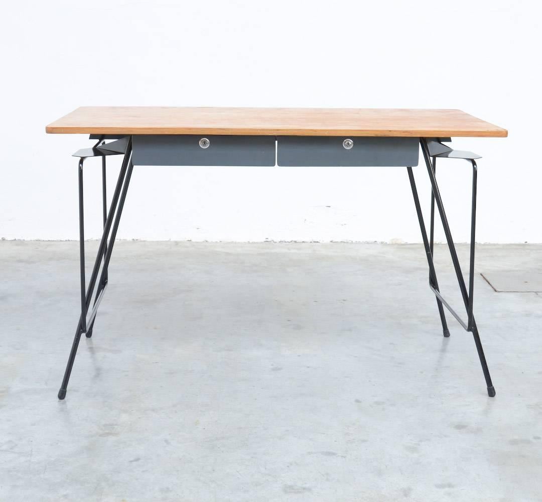 This desk was designed by Willy Van Der Meeren in the early 1950s and manufactured by Tubax.
Van Der Meeren designed this kind of desk for the private market, he worked together with Eric Lemesre.
The black lacquered metal frame is sophisticated