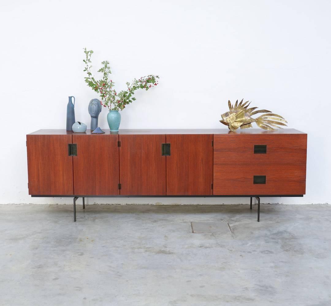 This is probably the most attractive sideboard of the well-known Japanese series, designed by Cees Braakman for Pastoe in 1958.
This one is the long version with four doors and four drawers.
It is a pure design with a floating effect thanks to the
