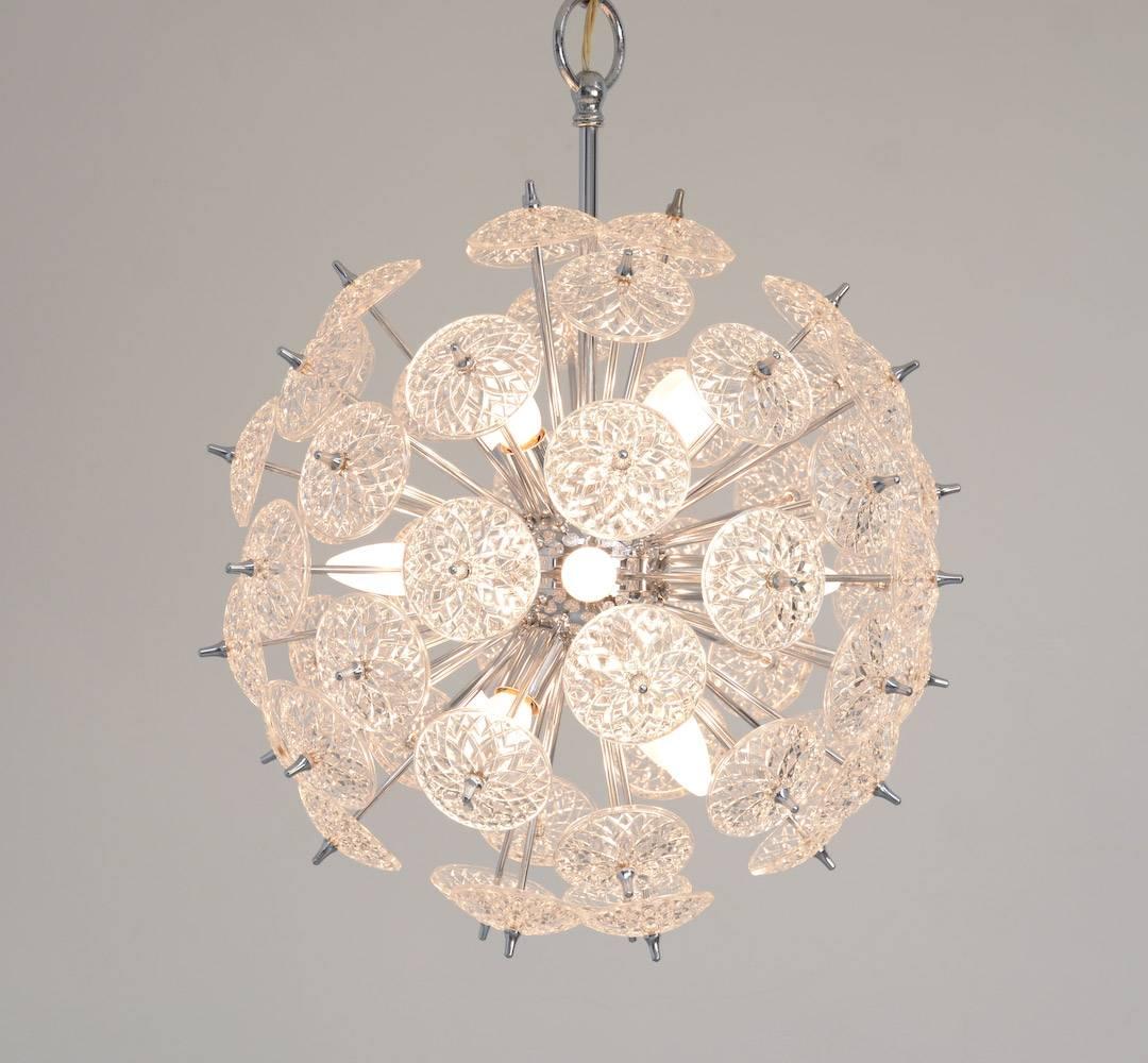 This chique midcentury Sputnik chandelier with cut-glass roundels on a nickel frame was made by Val Saint Lambert in Belgium. It gives off an amazing glow when illuminated.
This chandelier is in very good original condition.