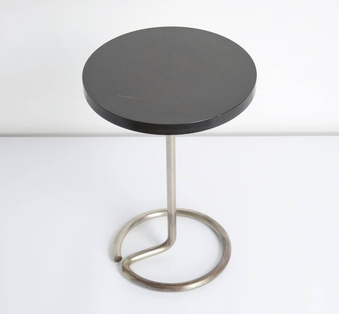 This minimal modernist side table was designed by René Herbst for Stablet in France, circa 1935.
The elegant tubular chromed base holds the black Bakelite round top.
This side table is in very good vintage condition, with normal signs of age and