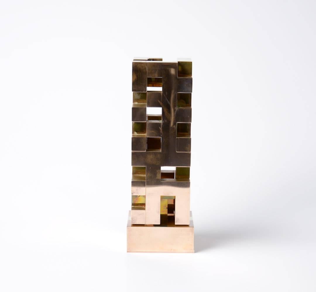 This super kinetic sculpture is made by the Danish artist Launy Christensen in 1978.
It is created in bronze and really sophisticated made. Let the detail pictures overwhelm you.
The sculpture moves by electric drive. 
This geometric sculpture is in