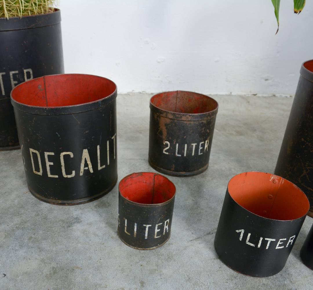 Belgian Decorative Set of 8 Vintage Metal Measuring Cups For Sale