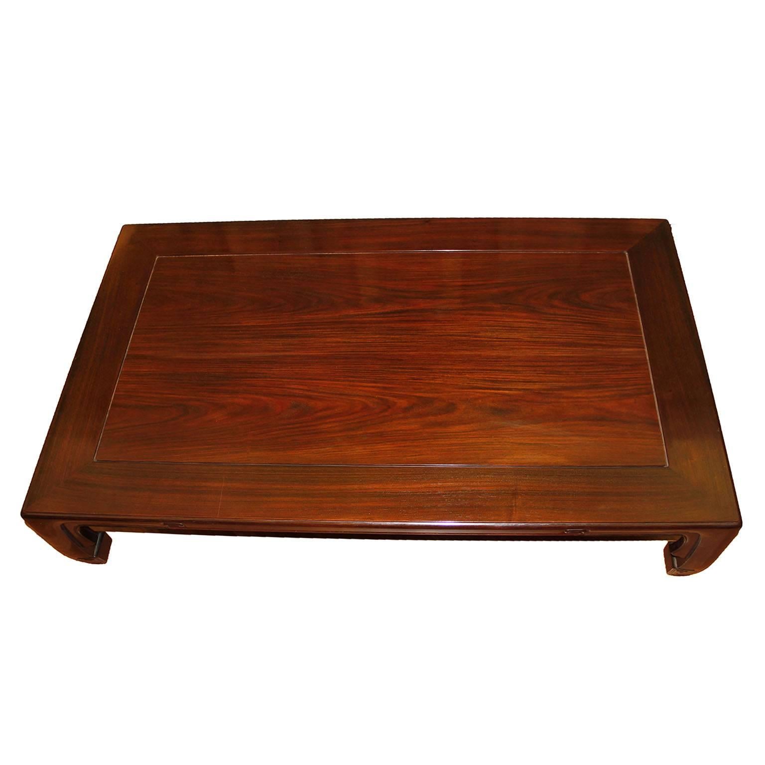 A dramatic Japanese low rectangular coffee table raised on black lacquered square legs. 

Dimensions:
12.99 in H x 60.23 in W x 35.82 in D
33 cm H x 153 cm W x 91 cm D.