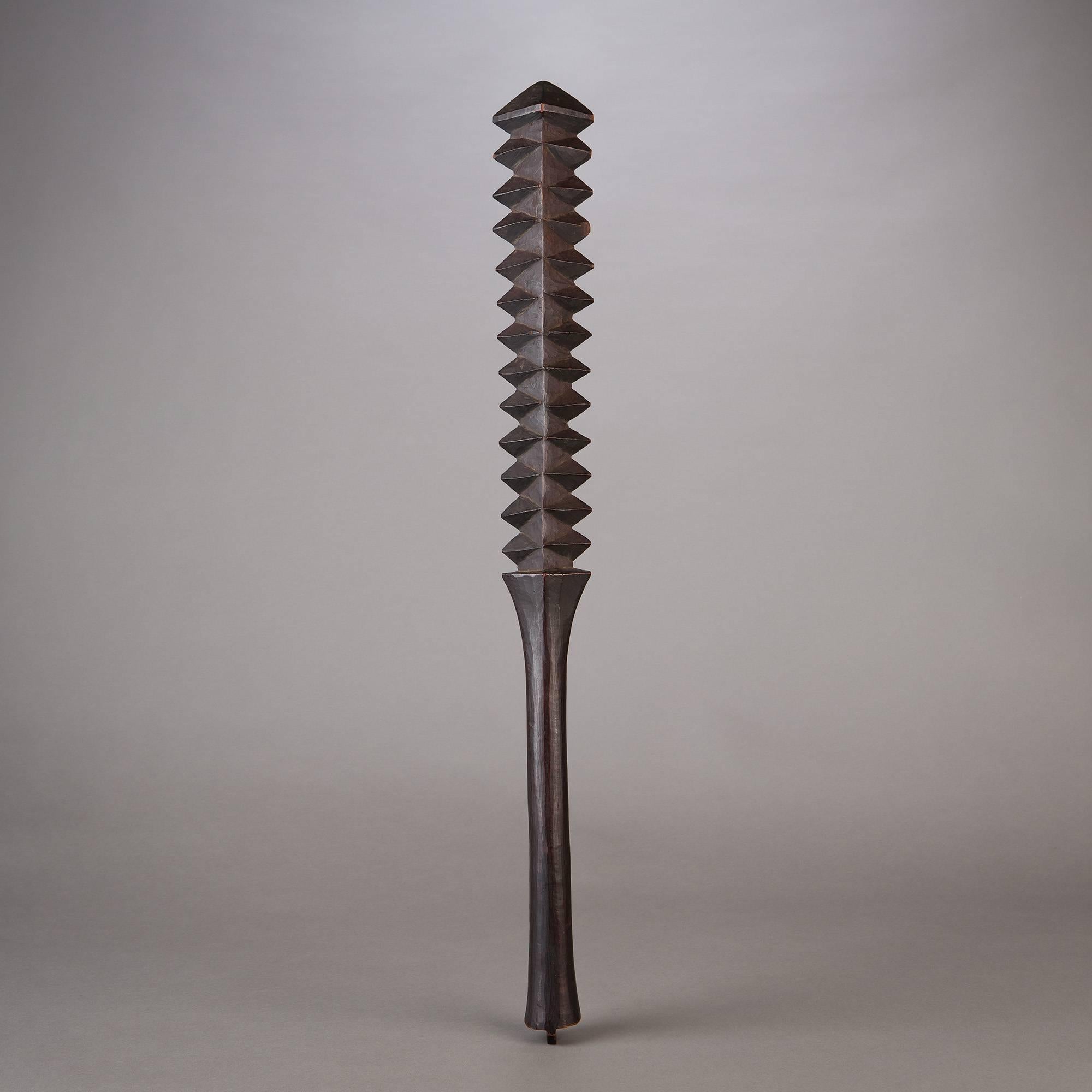 A well-formed club, or talavalu. The strict, angled symmetry and towering sculptural presence of this object give it amazing aesthetic power and contemporary appeal. Dark, dramatic patination from tip to tip only serves to add to this object's