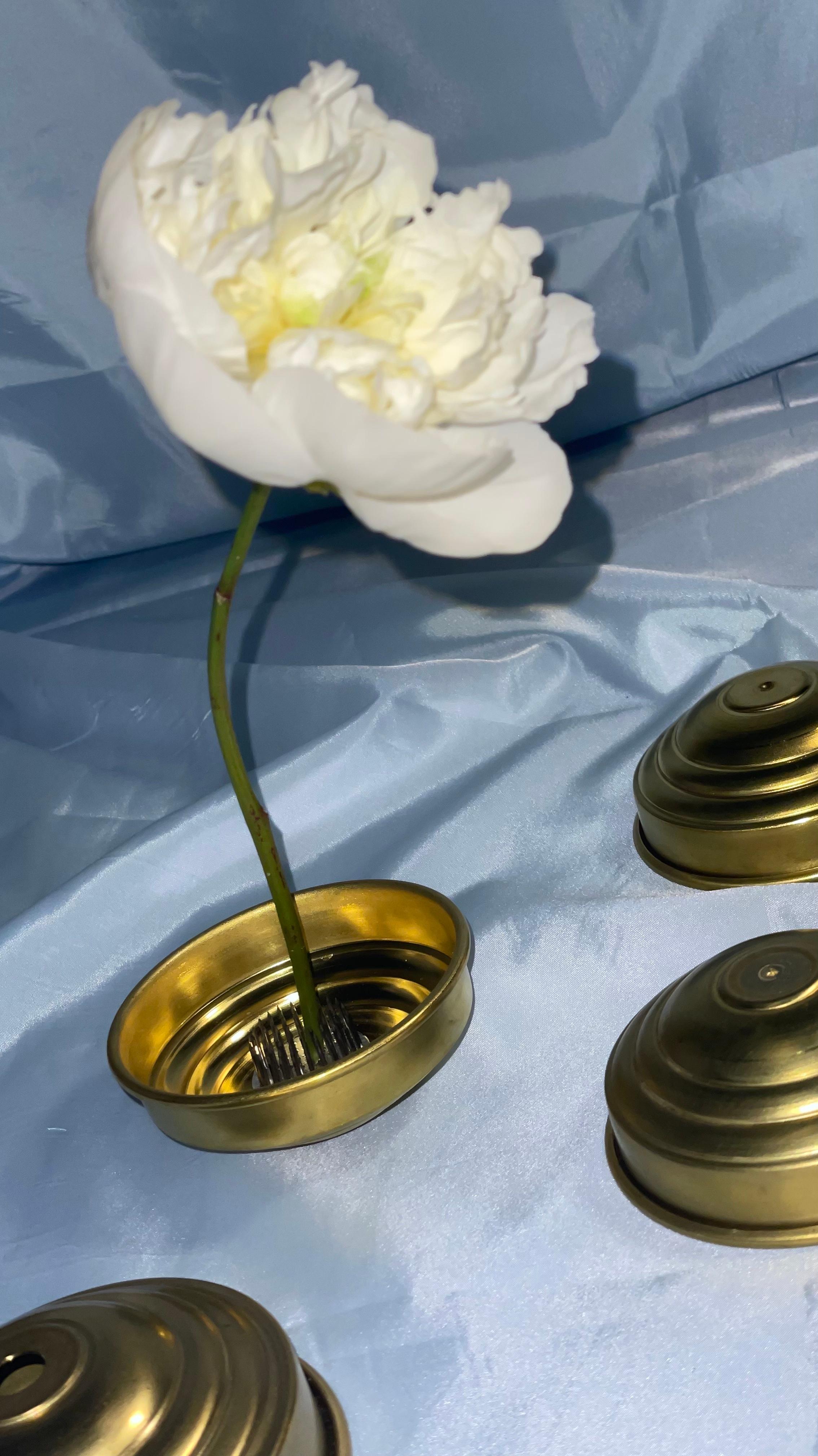 This set of 48 handcrafted satin brass bowls reflects a sophisticated blend of minimalist design and artisanal Italian craftsmanship. With their essential, sculptural form and elegant brushed finish, these small bowls serve as versatile decorative