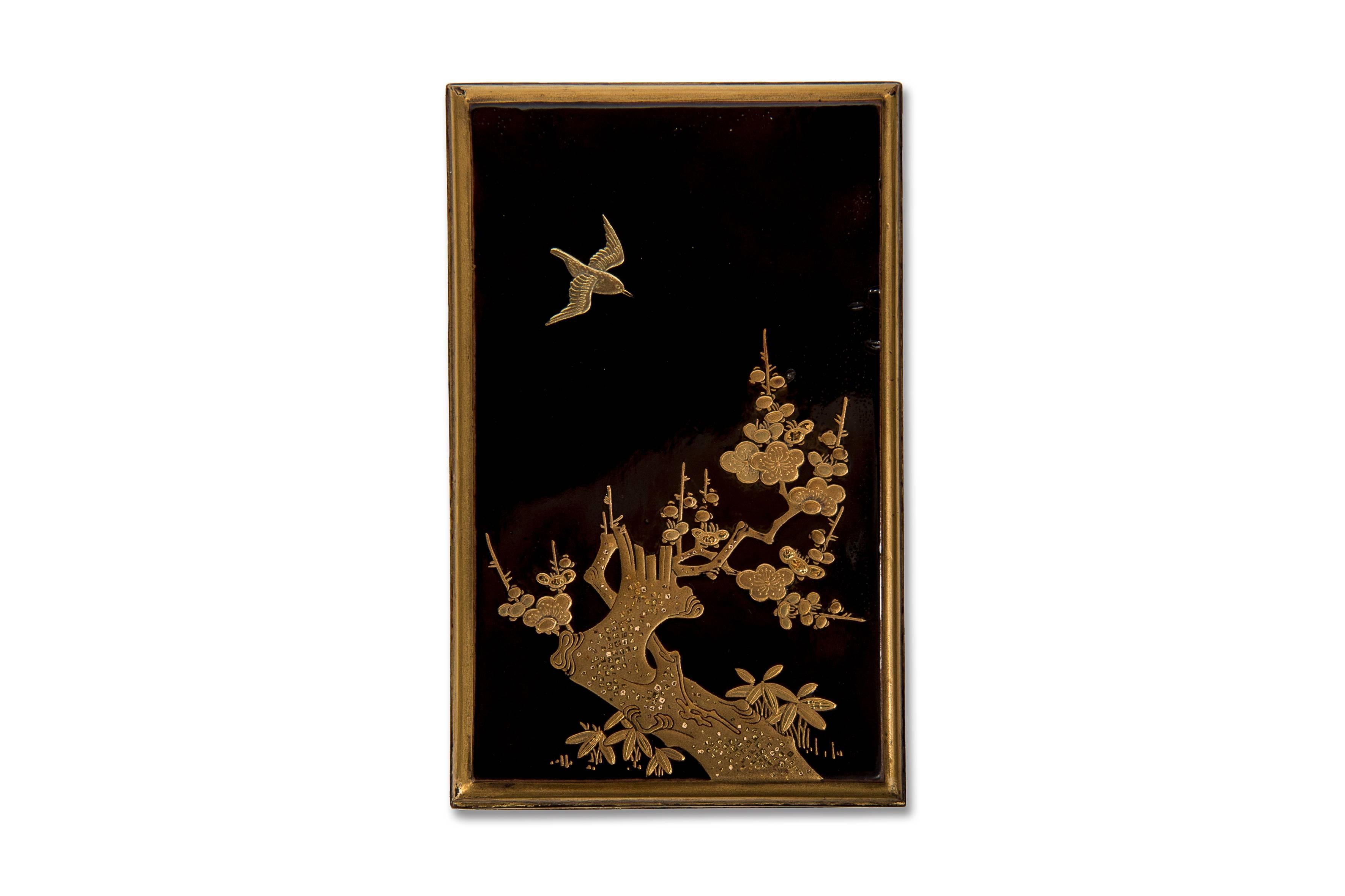 Very small suzuribako in black lacquer with hira maki-e gold lacquer decor of a flowering branch of prunus overflown by a bird. The sides decorated with flowering branches.
The nashi-ji lacquer interior contains a tray with a suzuri (ink stone) and