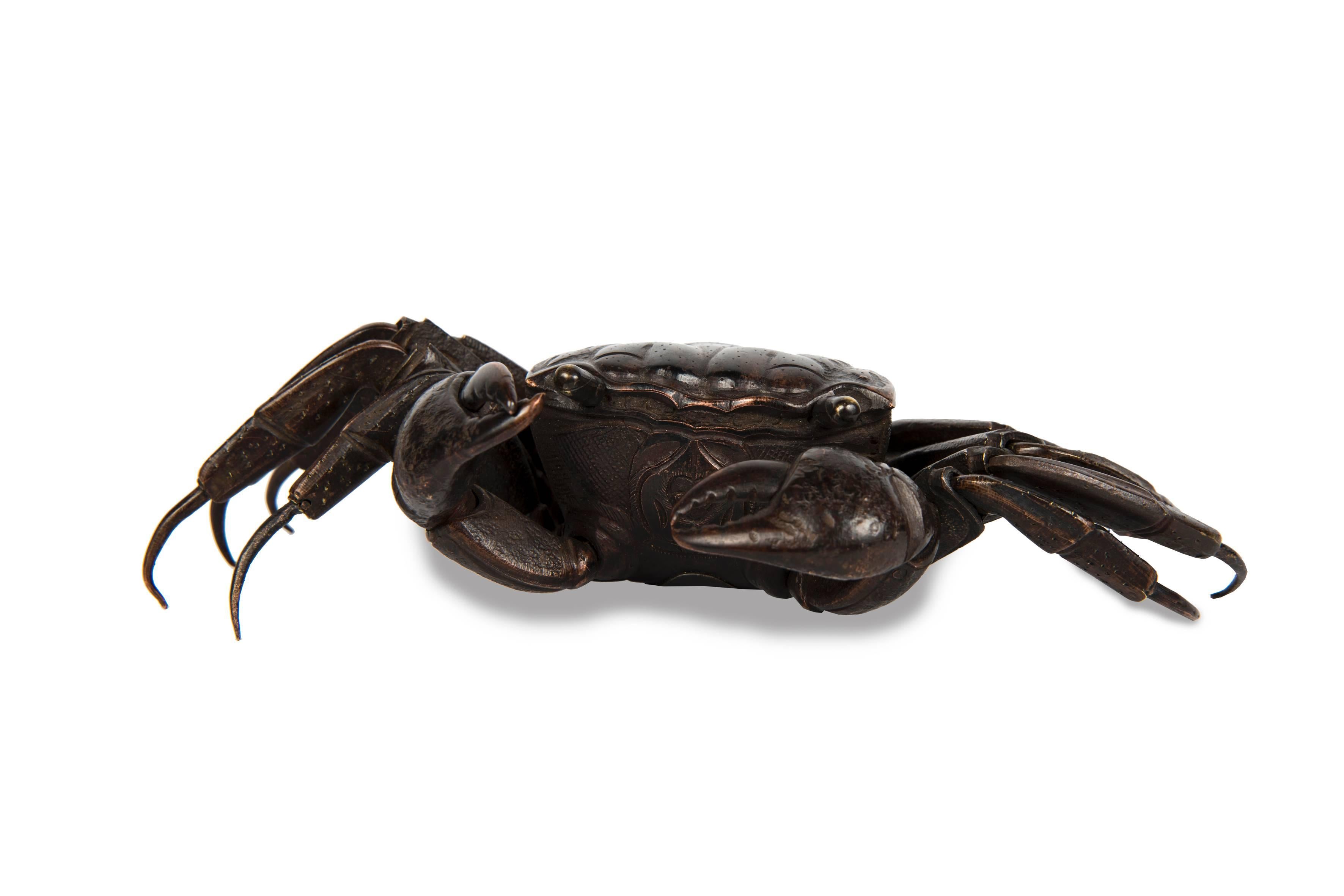 Bronze sculpture representing an articulated crab with brown patina, moving eyes.

Japan, Meiji (1868-1912)
Measures: Height 5 cm, length 20 cm, width 10 cm.

 